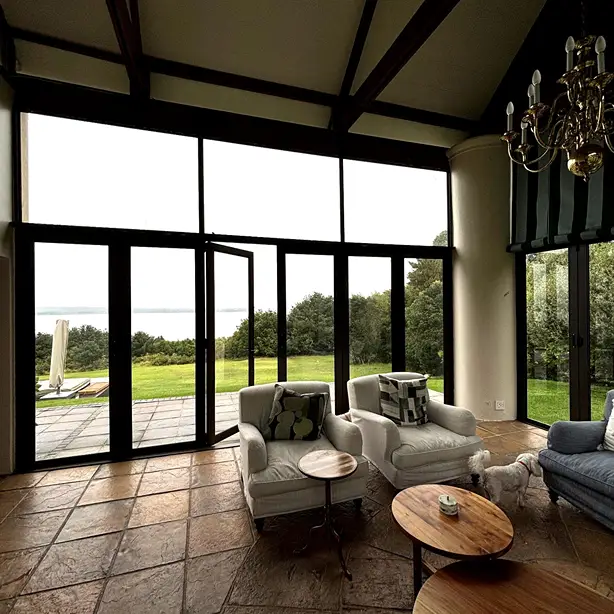 Stoep enclosure with black premium stacking doors with bronze aluminium finish
